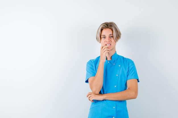 Expressive young boy posing in the studio