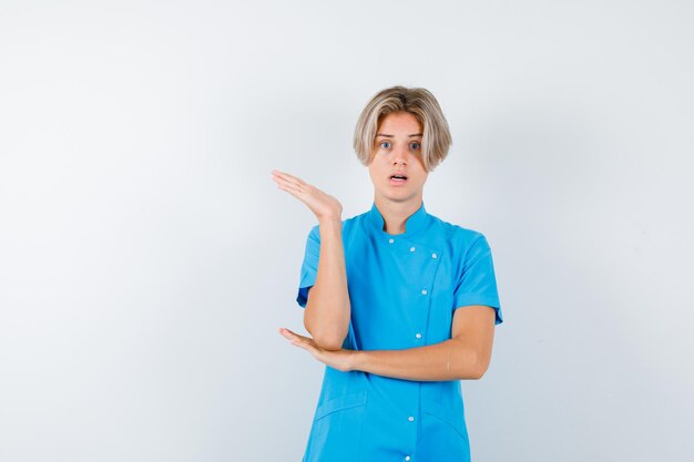 Expressive young boy posing in the studio