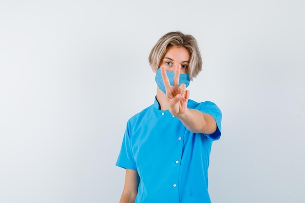 Expressive young boy posing in the studio