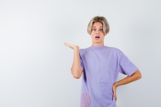 Expressive young boy posing in the studio