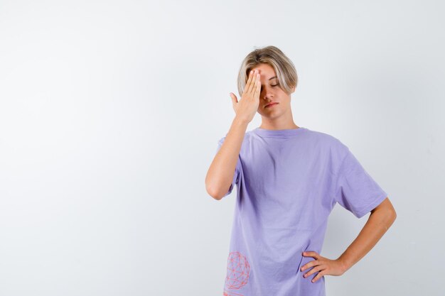 Expressive young boy posing in the studio