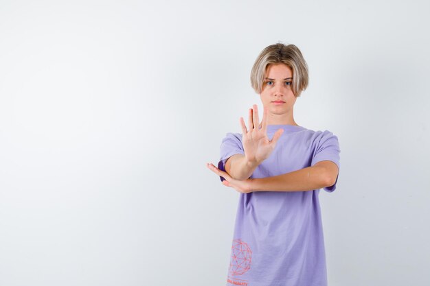 Expressive young boy posing in the studio