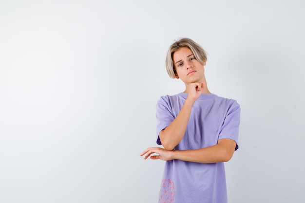 Expressive young boy posing in the studio