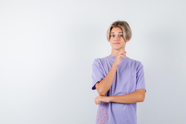 Expressive young boy posing in the studio