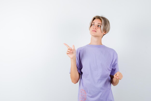 Expressive young boy posing in the studio