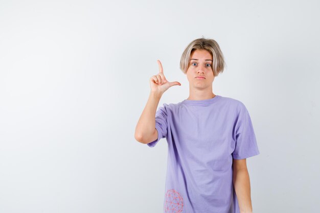 Expressive young boy posing in the studio