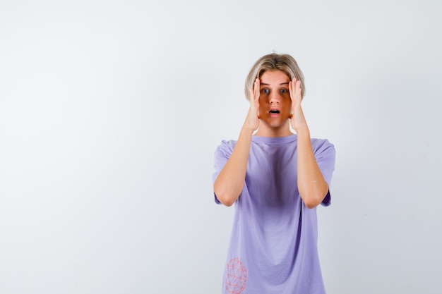 Expressive young boy posing in the studio