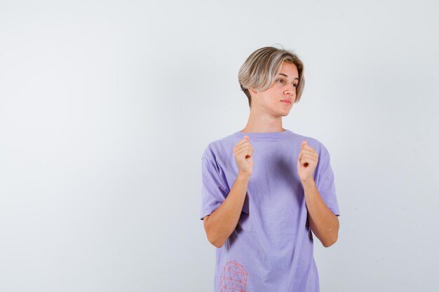 Expressive young boy posing in the studio