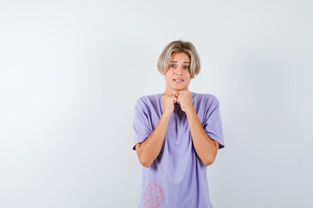 Expressive young boy posing in the studio