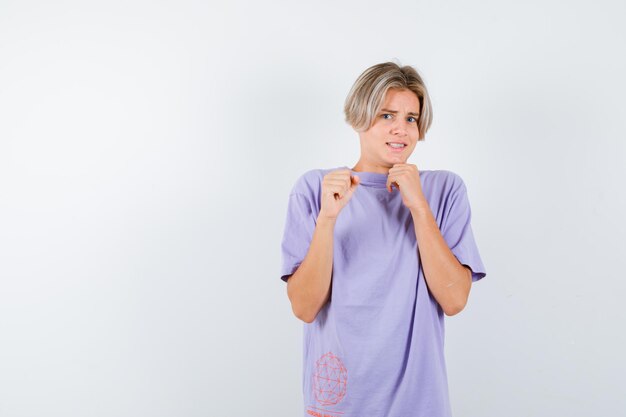 Expressive young boy posing in the studio