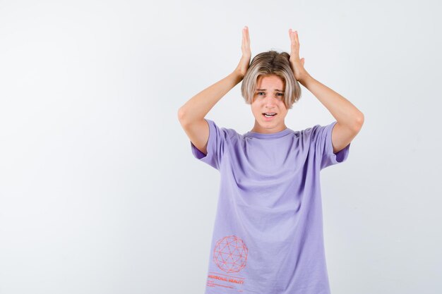 Expressive young boy posing in the studio