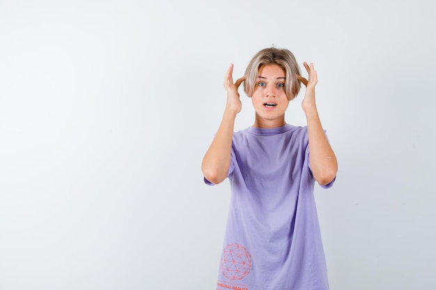 Expressive young boy posing in the studio