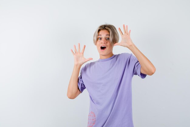 Expressive young boy posing in the studio