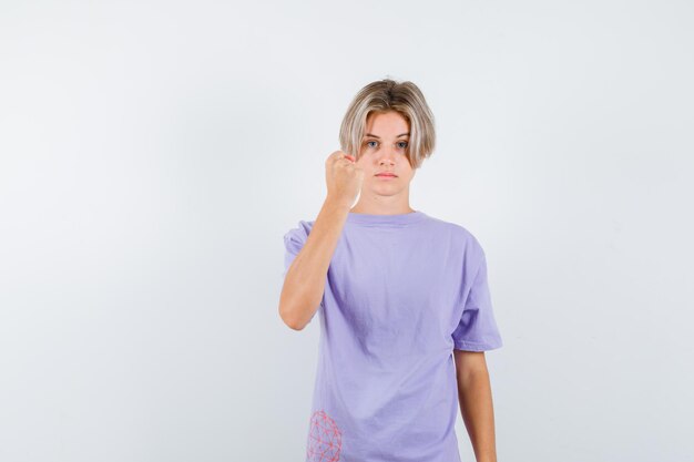 Expressive young boy posing in the studio