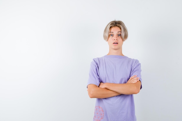 Expressive young boy posing in the studio