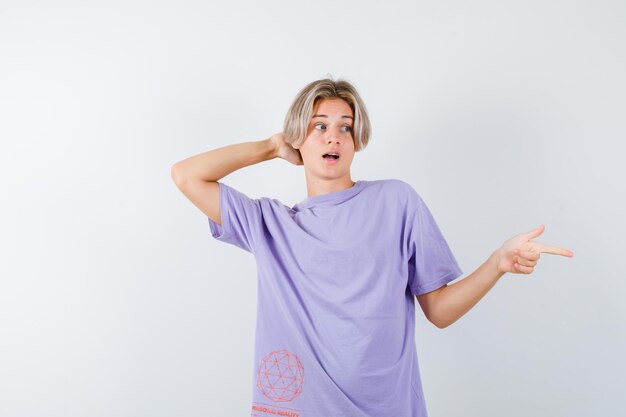 Expressive young boy posing in the studio