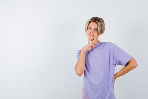 Expressive young boy posing in the studio