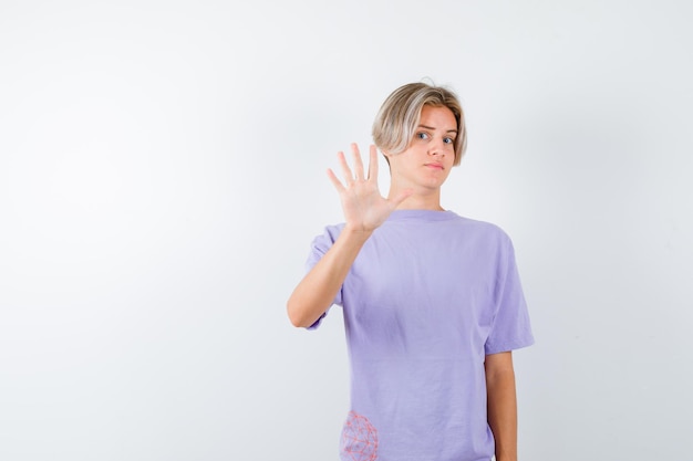 Expressive young boy posing in the studio