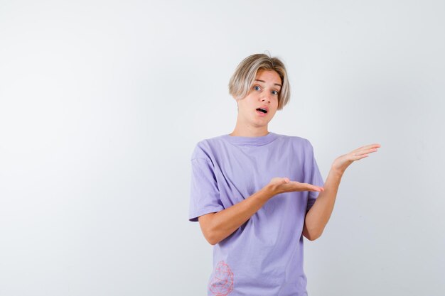 Expressive young boy posing in the studio