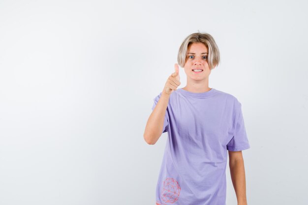 Expressive young boy posing in the studio