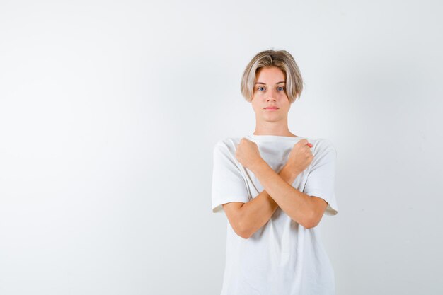 Expressive young boy posing in the studio