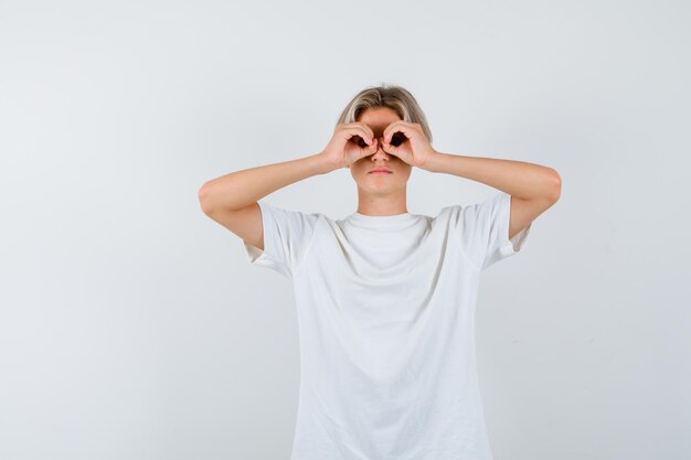 Expressive young boy posing in the studio