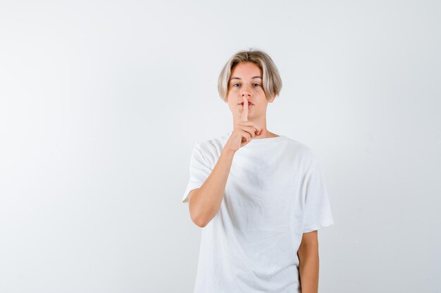 Expressive young boy posing in the studio