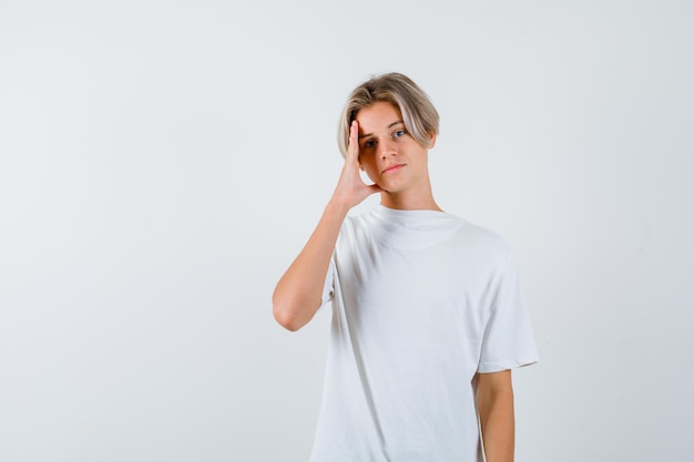 Expressive young boy posing in the studio