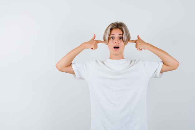 Expressive young boy posing in the studio