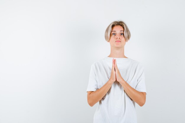 Expressive young boy posing in the studio