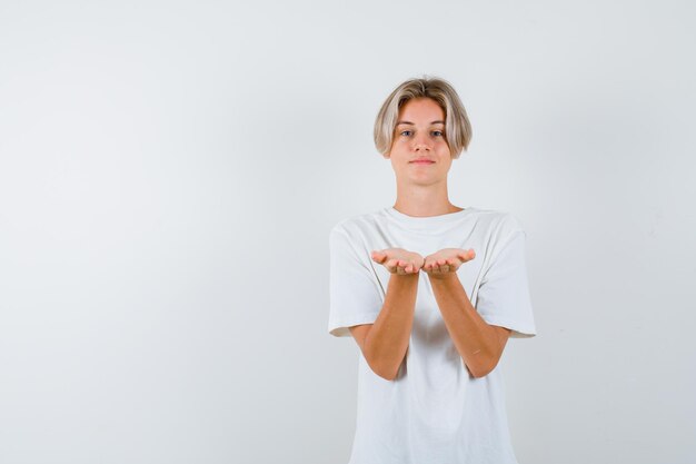 Expressive young boy posing in the studio