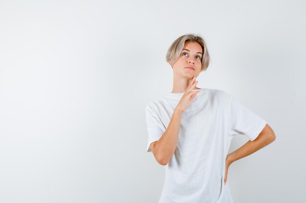 Expressive young boy posing in the studio