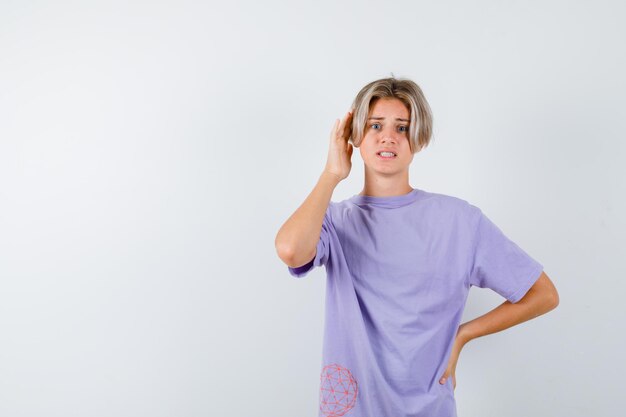 Expressive young boy posing in the studio