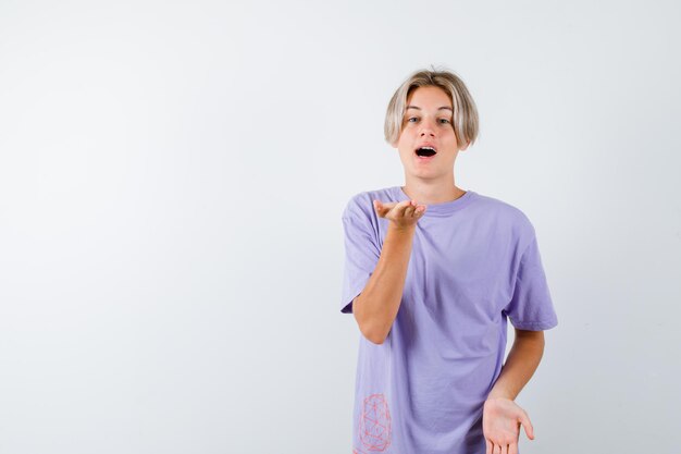 Expressive young boy posing in the studio