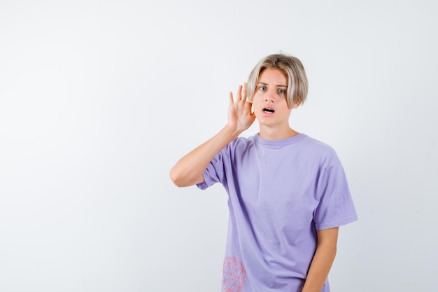 Expressive young boy posing in the studio