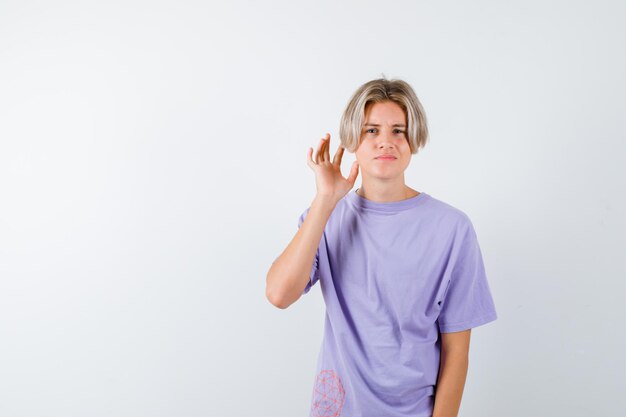 Expressive young boy posing in the studio