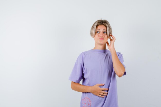 Expressive young boy posing in the studio