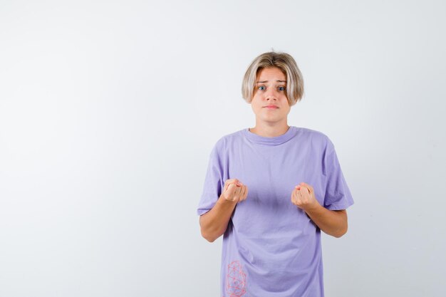 Expressive young boy posing in the studio