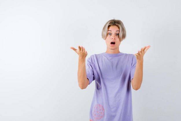 Expressive young boy posing in the studio