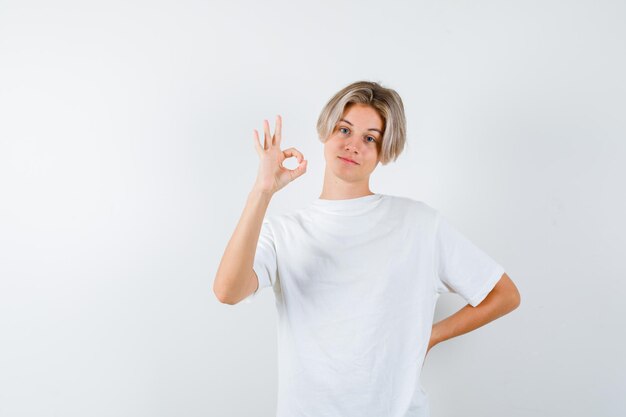 Expressive young boy posing in the studio