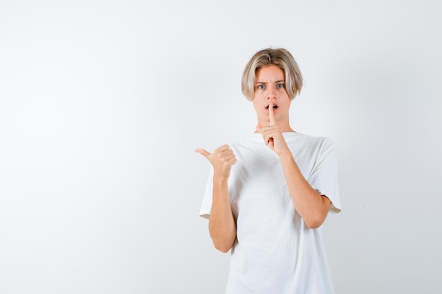 Expressive young boy posing in the studio