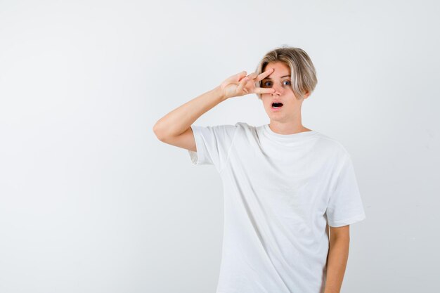 Expressive young boy posing in the studio