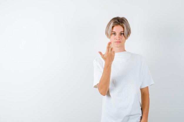 Expressive young boy posing in the studio