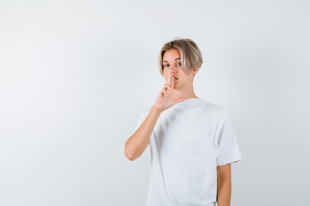 Expressive young boy posing in the studio