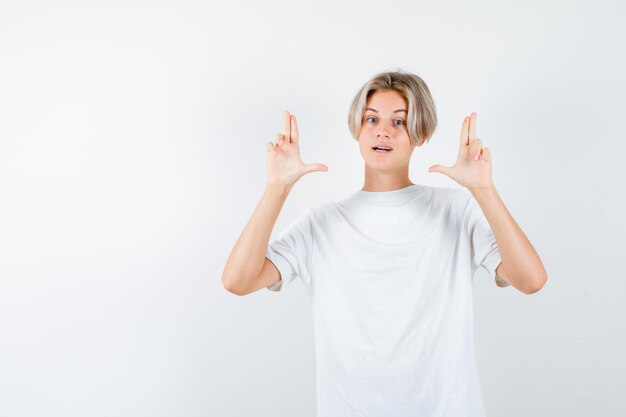 Expressive young boy posing in the studio