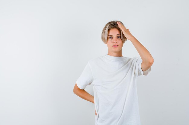 Expressive young boy posing in the studio