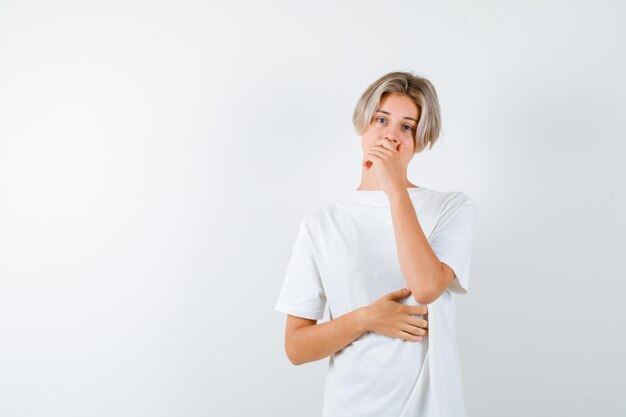 Expressive young boy posing in the studio