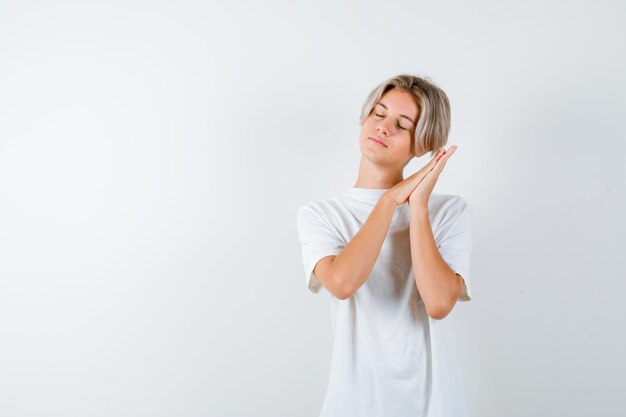 Expressive young boy posing in the studio