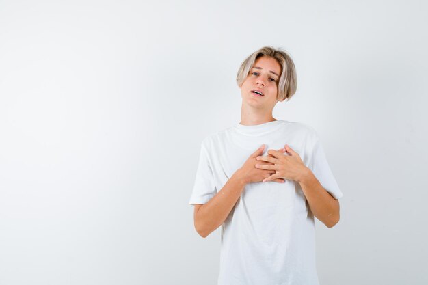 Expressive young boy posing in the studio