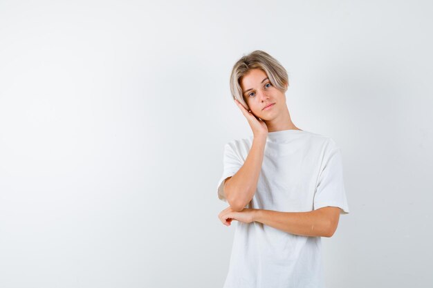 Expressive young boy posing in the studio